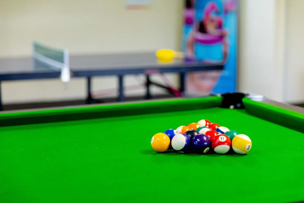 Pool table in games room at holiday park. Affordable Family Cabins Near Melbourne Airport: Kitchens, Space, and Kid-Friendly Facilities