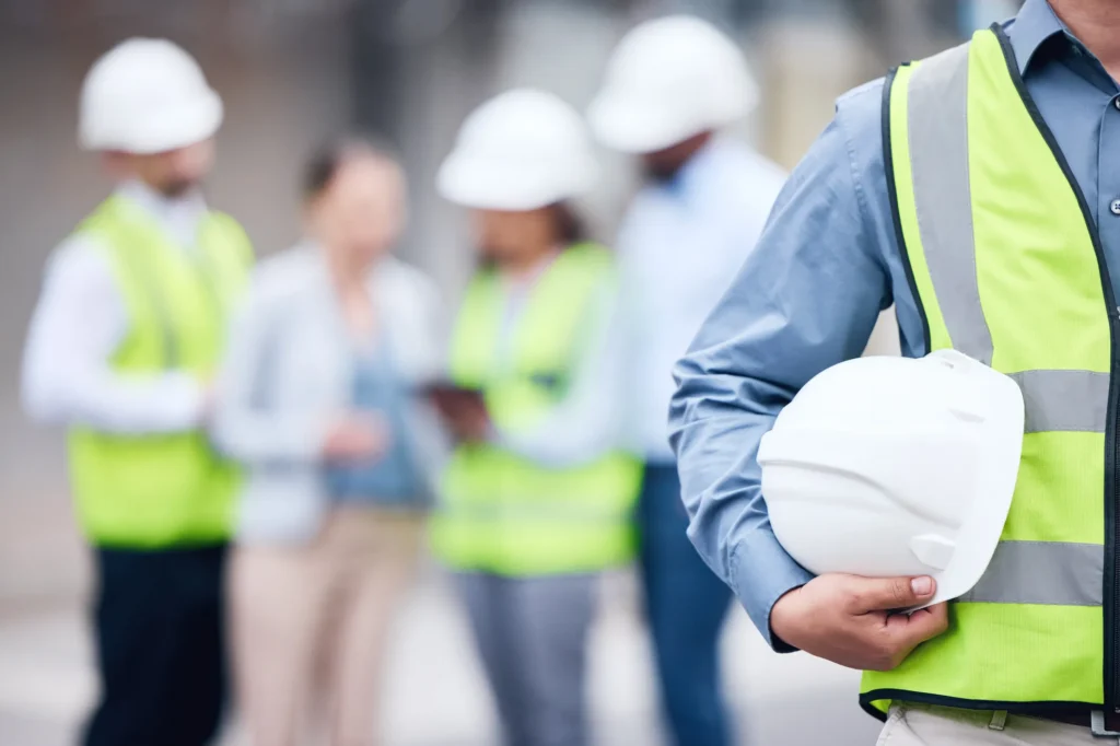 Project workers wearing high-vis and hard hats. Melbourne airport accommodation
