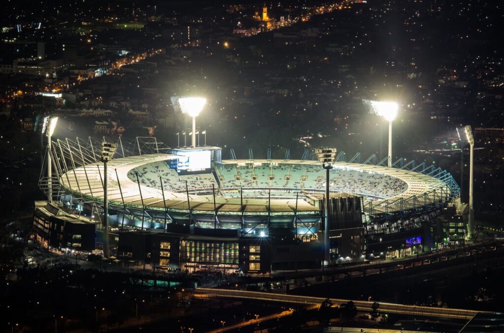 Melbourne Cricket Ground (MCG) at night from far away. A guide to Melbourne’s best sports grounds